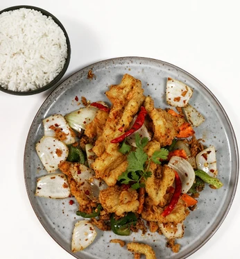 Crispy wok-tossed dish with chilies and onions from Lucky Koi Express